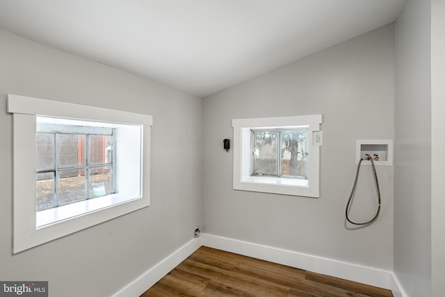 laundry room featuring washer hookup, hardwood / wood-style floors, and plenty of natural light