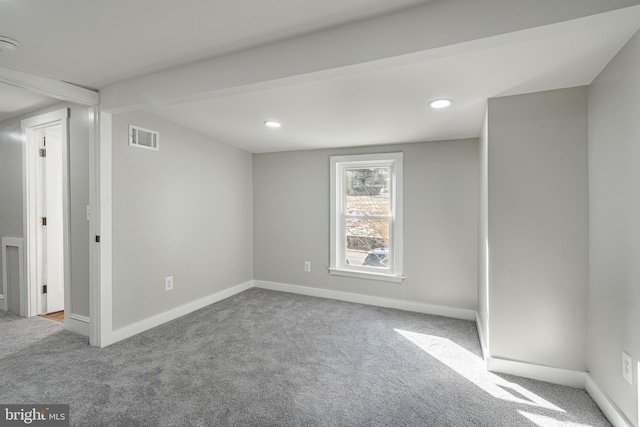 unfurnished room with light carpet