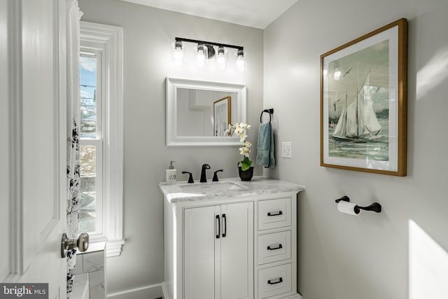 bathroom with a wealth of natural light and vanity