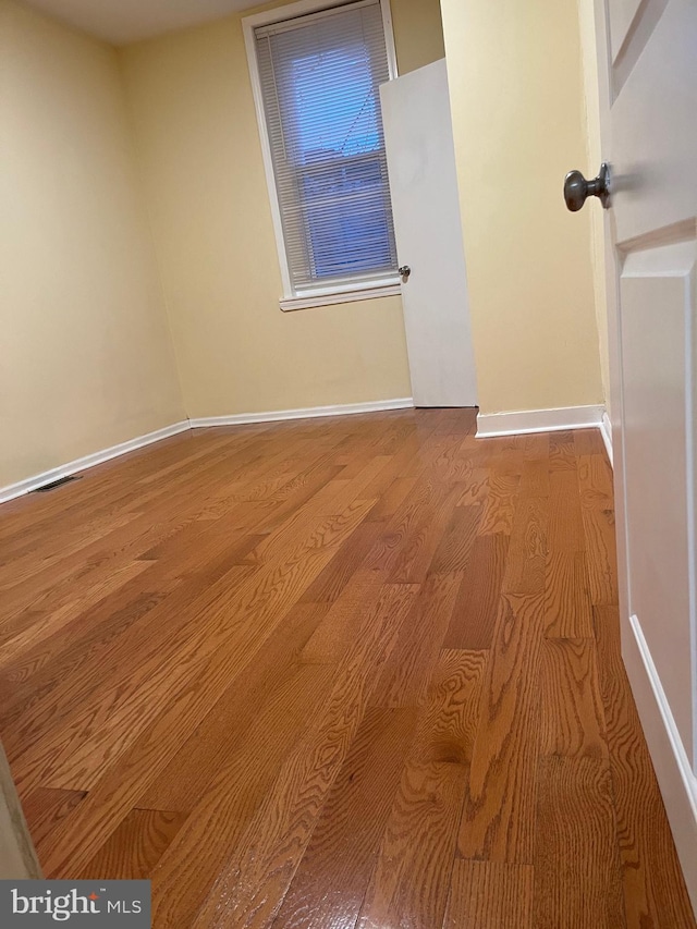 spare room with light hardwood / wood-style flooring