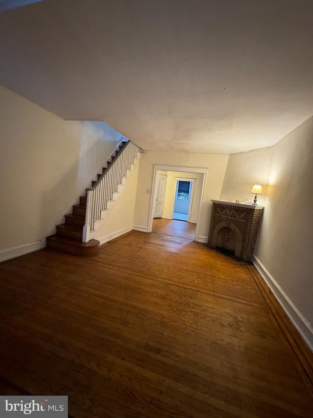 interior space featuring dark hardwood / wood-style floors and a fireplace