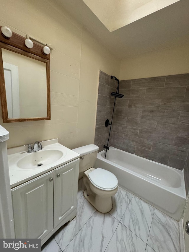 full bathroom with vanity, toilet, and tiled shower / bath combo