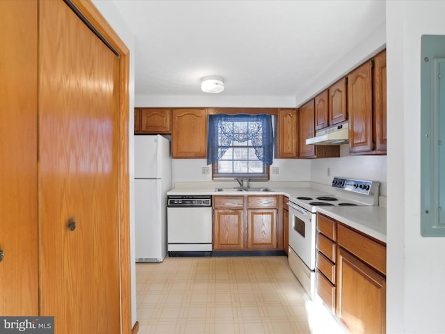 kitchen with sink and white appliances