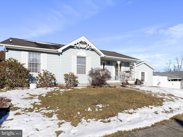 view of front facade featuring a yard and covered porch