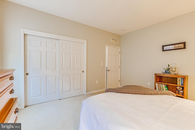 carpeted bedroom featuring a closet