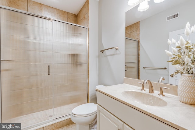 bathroom featuring walk in shower, vanity, and toilet