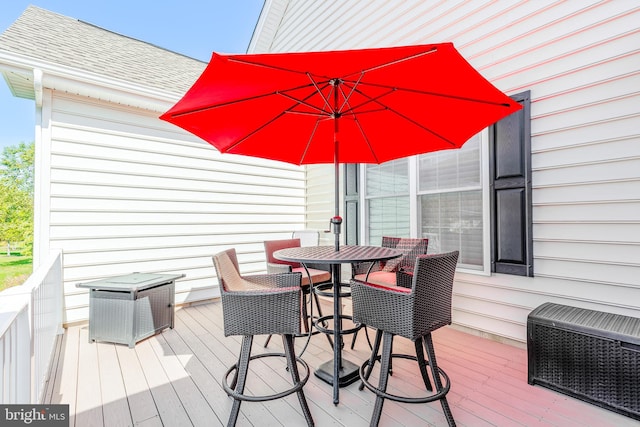 wooden terrace featuring heating unit