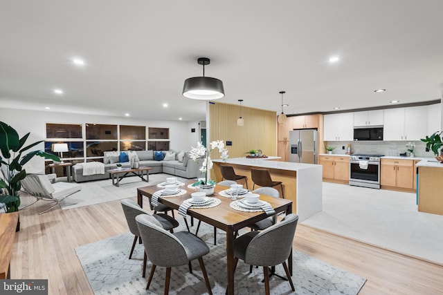 dining room featuring light hardwood / wood-style floors