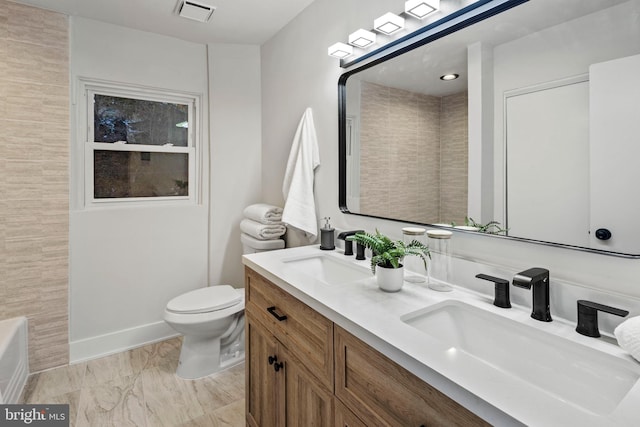 bathroom with vanity and toilet