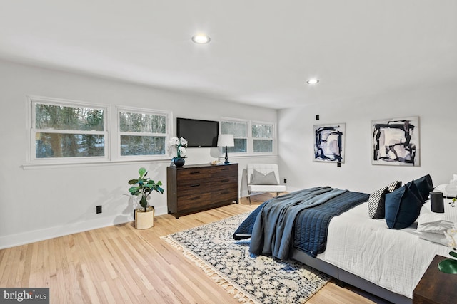 bedroom with hardwood / wood-style flooring