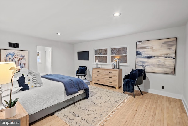 bedroom with light hardwood / wood-style floors