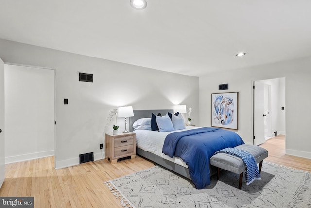 bedroom with wood-type flooring