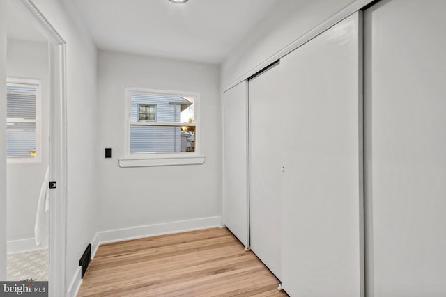 hallway featuring light wood-type flooring