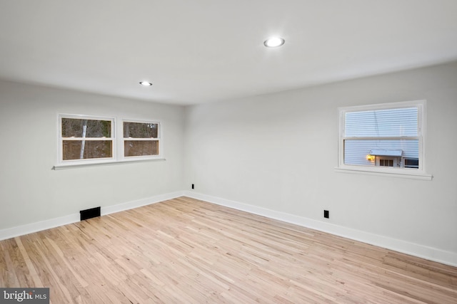 unfurnished room featuring light hardwood / wood-style floors