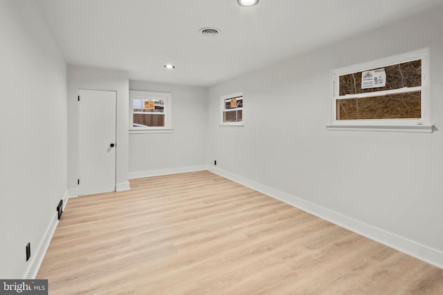 unfurnished room featuring light wood-type flooring