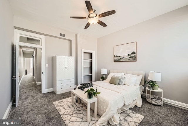 bedroom featuring ceiling fan, baseboards, visible vents, and dark carpet