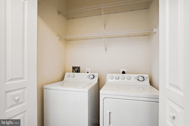 washroom with separate washer and dryer