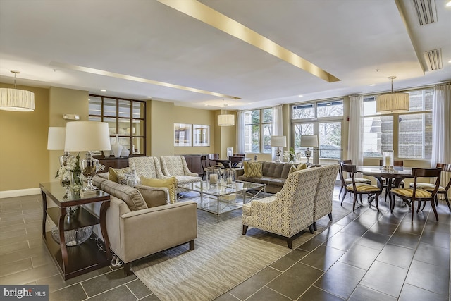 living room with floor to ceiling windows