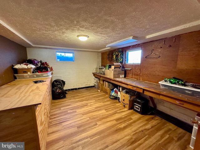 interior space with light hardwood / wood-style flooring and a textured ceiling