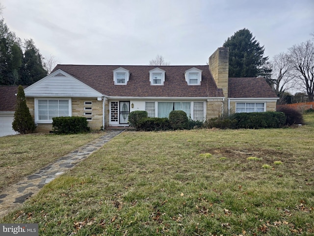 new england style home featuring a front yard