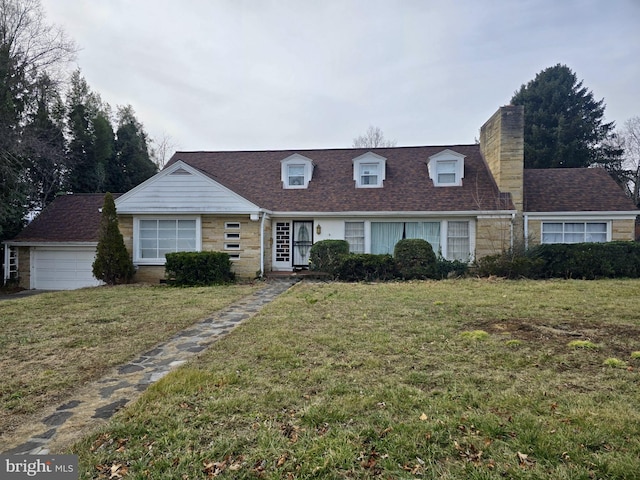 view of front facade featuring a garage and a front yard