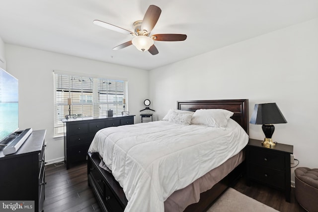 bedroom with ceiling fan and dark wood-type flooring