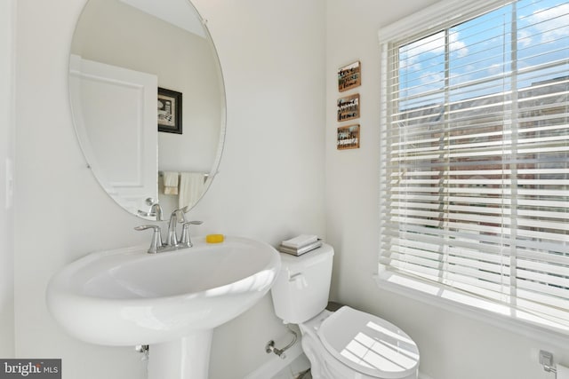 bathroom with toilet and sink