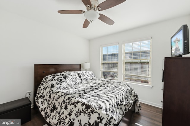 bedroom with ceiling fan and dark wood-type flooring