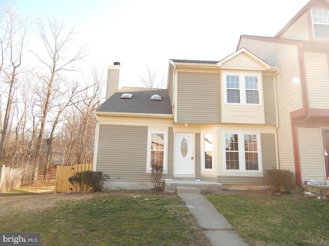 view of front of property with a front lawn