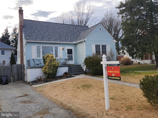 view of front of home with a front yard