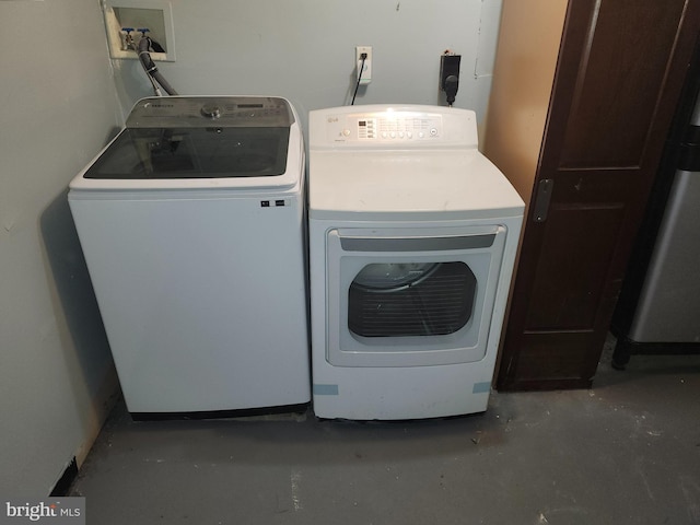 laundry area with independent washer and dryer