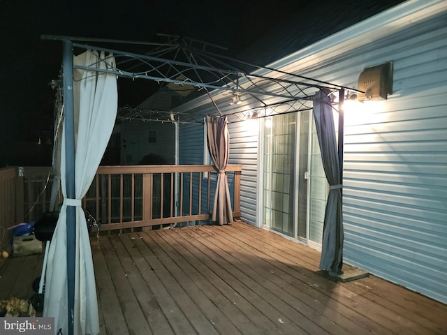 wooden deck featuring a gazebo