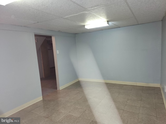 empty room with a paneled ceiling