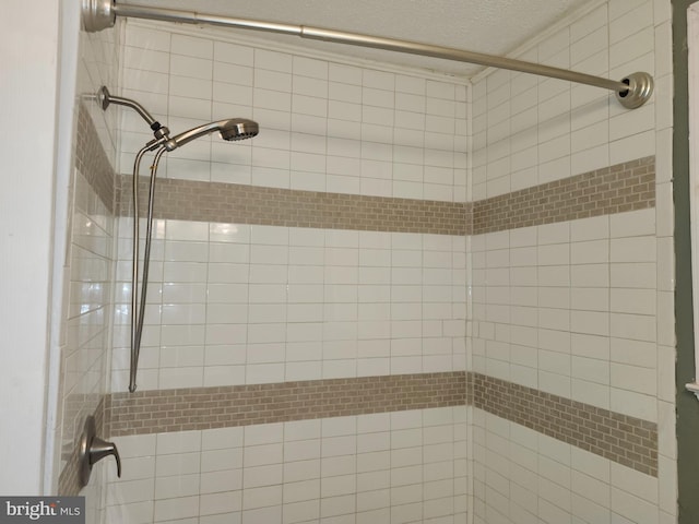 bathroom featuring a tile shower