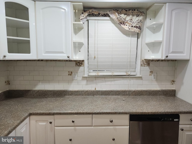 kitchen with white cabinets, decorative backsplash, and dishwasher