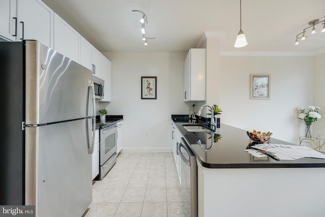 kitchen with pendant lighting, white cabinetry, sink, and stainless steel appliances