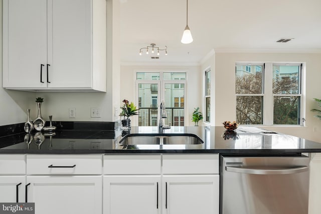 kitchen featuring ornamental molding, sink, dishwasher, white cabinetry, and hanging light fixtures