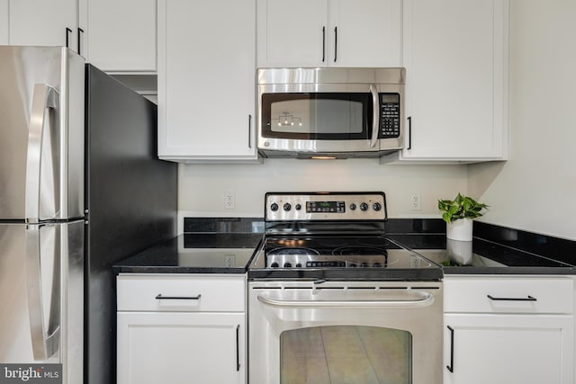 kitchen with white cabinetry and stainless steel appliances