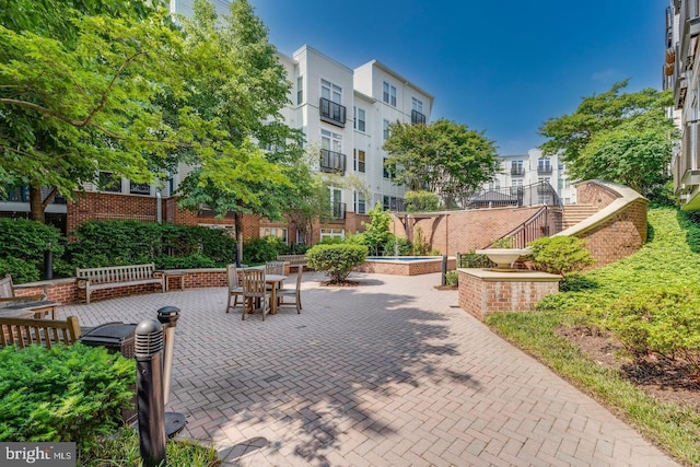 surrounding community featuring a patio