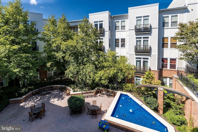 view of pool featuring a patio area