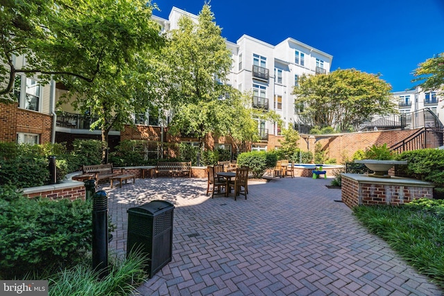 view of property's community featuring a patio area