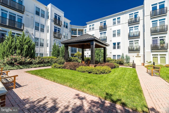 view of home's community featuring a gazebo and a lawn