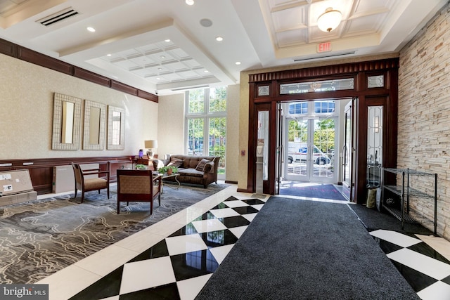 foyer entrance featuring crown molding