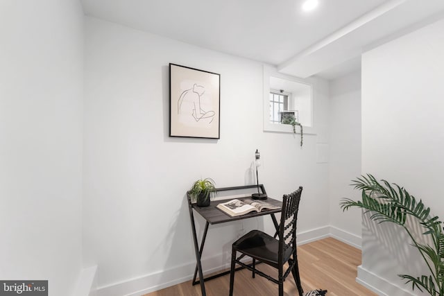 home office with hardwood / wood-style flooring