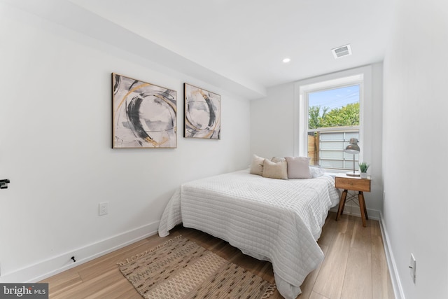 bedroom with light hardwood / wood-style flooring