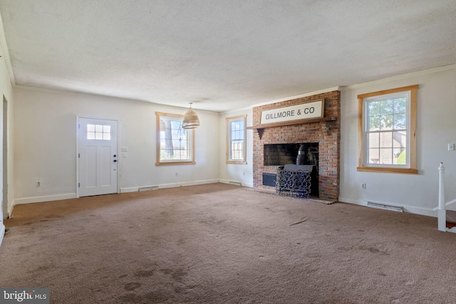 unfurnished living room featuring crown molding, plenty of natural light, a baseboard radiator, and a brick fireplace