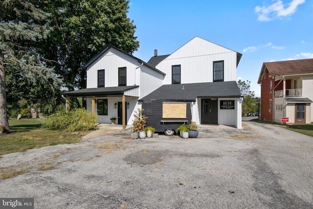 modern inspired farmhouse with a porch