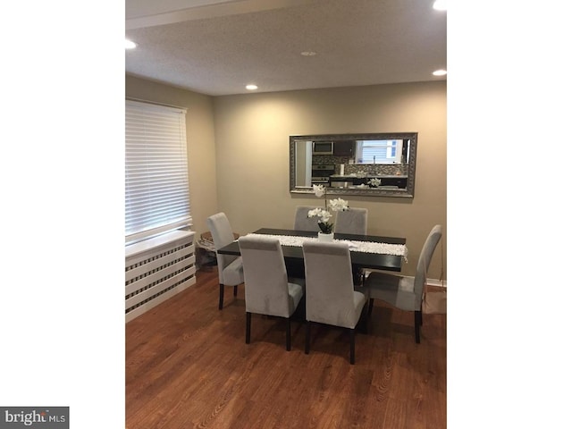 dining space with dark wood-type flooring