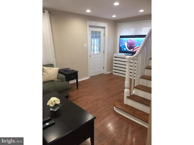 living room featuring dark hardwood / wood-style floors