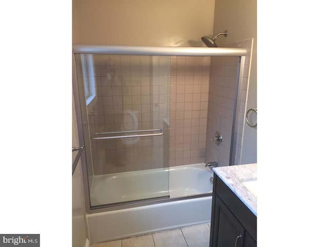 bathroom with shower / bath combination with glass door, vanity, and tile patterned floors